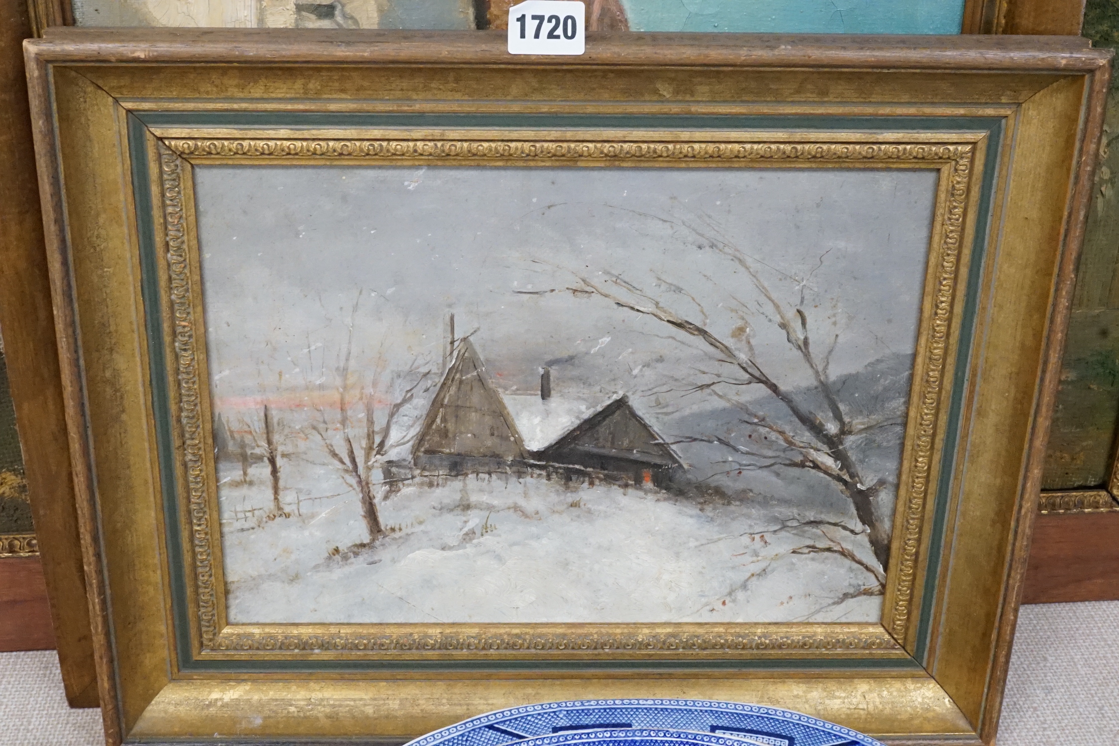 T. Baines, oil on canvas, Spanish town square, signed, 40 x 50cm, an oil on board of a cottage in winter, 24 x 33cm, and an Italian oil street scene, 52 x 67cm